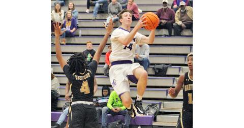 Standout Jacob Cumbie flies through the lane for two of his 17 points during Lumpkin’s region win over East Hall. Cumbie finished the game with a double-double, scoring 17 points and pulling down 10 rebounds.