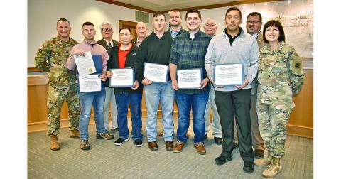 Local residents who served in the Georgia National Guard 48th Infantry Brigade were honored by Lumpkin County Board of Commissioners for their service in Afghanistan as one of the last acts of 2019. Attending last week’s meeting were (front row, from left) Lt. Comm. Nathaniel Stone; staff sergeants Ashton Sanford, Jose Alvarez and Nick Bauth,  1st lieutenants William Mayfield and Edgar Rojas and National Guard Chaplain Maj. Leslie Chandler. Board of Commissioners David Miller, Jeff Moran, Rhett Stringer, Bo