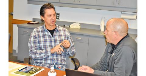 Developer Jack Hartrampf (left) speaks with Commissioner Jeff Moran during a break in one of two meetings on possible changes to the Gateway Corridor merely days before Lumpkin County commissioners were scheduled to vote on the new regulations. Hartrampf showed up at the public hearing on the Corridor to voice concerns.