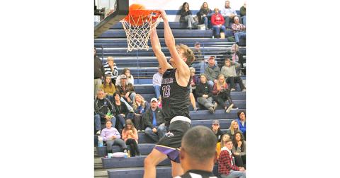 Peyton Polk throws down a monster dunk late in the fourth quarter versus Banks County during Lumpkin's 85-67 victory over the Leopards.