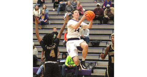 Standout Jacob Cumbie flies through the lane for two of his 17 points during Lumpkin’s region win over East Hall. Cumbie finished the game with a double-double, scoring 17 points and pulling down 10 rebounds.