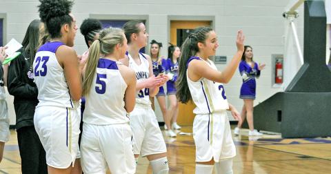 Lady Indians point guard Isabel Davenport receives congratulations from her teammates and recognition from the Lumpkin faithful after she knocked down the 1,000th point of her career against the GAC Lady Spartans at the Longhouse last week.