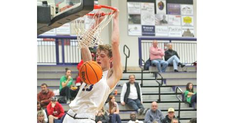 Senior Peyton Polk throws down an emphatic dunk at the buzzer versus the White County Warriors at the Longhouse on Saturday, Jan. 18.