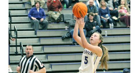 Lumpkin County guard Lexi Pierce finishes a fast break with an easy layup against the White County Lady Warriors. Pierce, a freshman, averaged just over 11.5 points a game during the team’s last three contests.