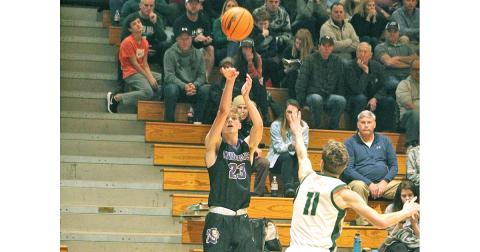 Lumpkin County's Peyton Polk lets a three-pointer fly versus the North Hall Trojans. Polk led the Lumpkin offense with 10 points in the 60-40 loss to the Trojans.