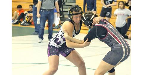 Lady Indians wrestler Olivia Gilleland locks up with one her opponents at the Burnt Mountain Classic. Gilleland won her first tournament championship of her career with a first place finish at the event.