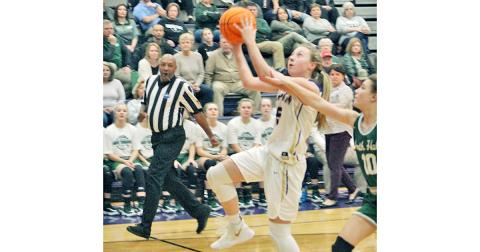 Lexi Pierce flies through the lane for two of her 16 points in Lumpkin’s come-from-behind win over North Hall last week.