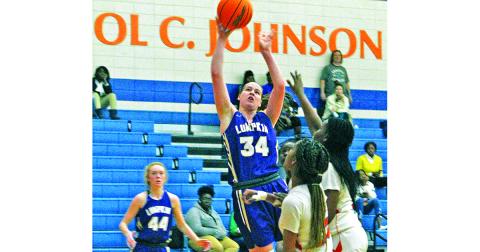 Junior Makenzie Caldwell goes up strong against the Atom Smashers’ defense for a bucket and one during the Lady Indians’ loss to Johnson Savannah this past weekend.