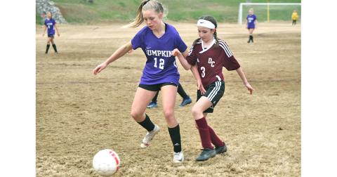 LCMS Lady Indians striker Ciera Brooks dribbles past a defender on her way to one of her three goals in Lumpkin’s win over rival Dawson County last week.