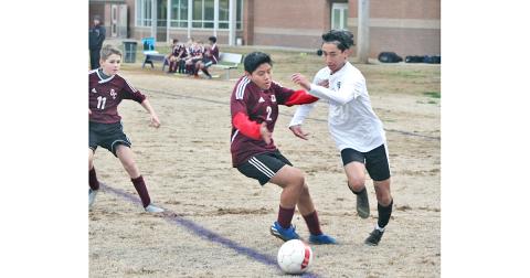 LCMS striker Nicholas Esqueda gets around a Dawson County defender to get inside the box in Lumpkin’s 2020 season opener last week. Esqueda scored three second half goals to help lead the Indians to a 4-0 victory.