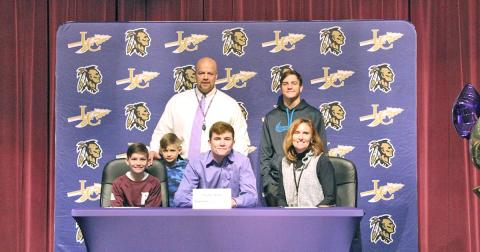 Tucker Kirk (front center) celebrates signing with Sewanee University with his family during a ceremony held at the LCHS auditorium recently. Pictured: (back row left to right) Kirk’s father and LCHS principal Billy Kirk, Kirk’s brothers Tanner Kirk, (front row left to right) Tate Kirk, Truett Kirk and his mother Jennifer Kirk.
