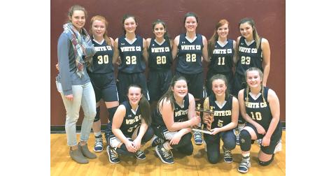 Former Lumpkin County basketball player Dakota Sullens poses with her JV team in her first season as White County JV head girls basketball coach. The former Lumpkin standout has coached at White County for the past two seasons.