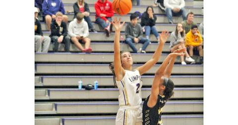 Isabel Davenport absorbs some contact as she scores two points for the Lady Indians basketball team during the 2019-2020 season.
