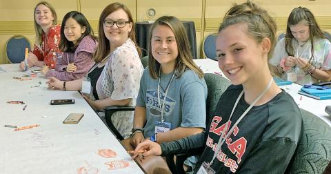 Members of the 2019-2020 LCHS yearbook staff (from right) managing editors Charlotte Cunningham and Olivia Gilleland, photo editor Lacy Gilreath and copy editors Autumn Cleymans and Brianne Anderson hone their yearbook design skills at the Herff Jones Yearbook Expo last July.
