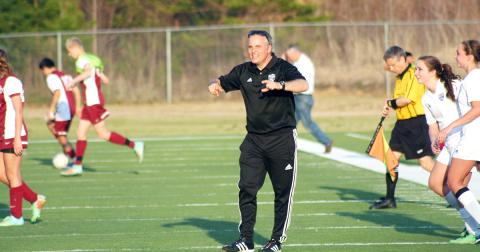Don Brock cheers on his players after a victory over rival Dawson County. The long-time LCHS girls soccer coach’s career was recognized recently when he was named to Blitz’s Legendary Coaches list.