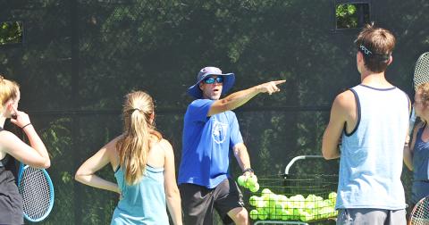 UNG head tennis coach gives instructions for a drill to campers of the UNG tennis camp last week. 