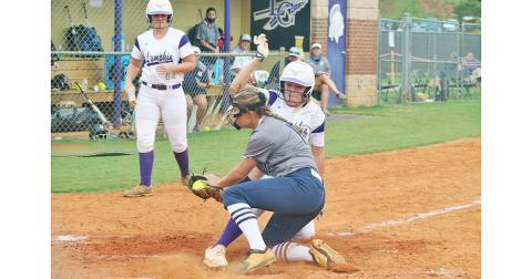 Lady Indians right fielder Haley Voyles slides in safely at home after a wild pitch by White County’s pitcher. Voyles had a solid performance against the Lady Warriors in the Lumpkin win.