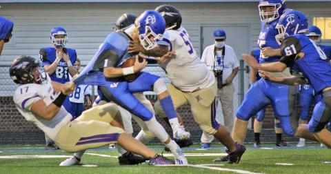 Led by Drew Allison (left) and JoJo Allison, the Lumpkin defense blow up the first play of the game from scrimmage, sacking the quarterback and wreaking havoc.