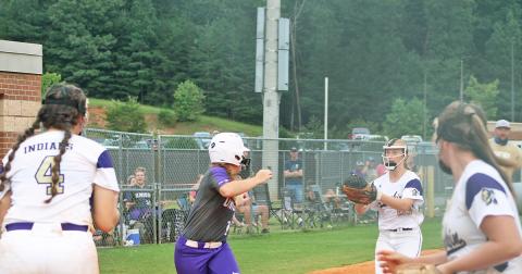 Lady Indians Kelsey Marshall and Kloee Graham run down a Union County player for an out.