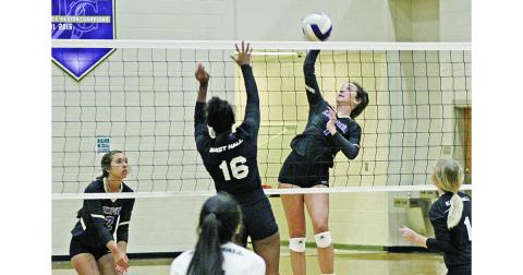 Addie Rucker gets up and finesses the ball past the Vikings during Wednesday’s volleyball game at the Longhouse. The Indians won all three sets in the best-of-five matchup, staying on pace for the best season in program history.