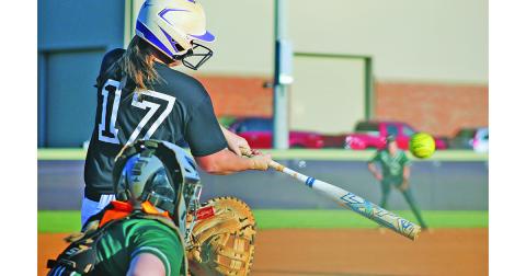 Lumpkin’s sophomore catcher Natalie Shubert smashes a pitch against North Hall during last week’s 3-1 victory.