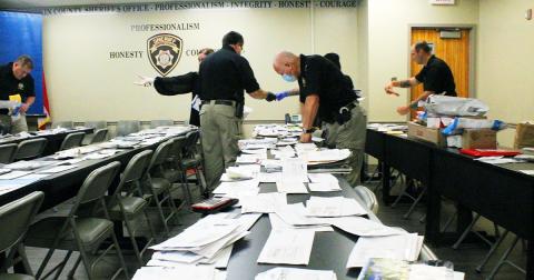 Members of the Lumpkin County Sheriff's Office investigations unit spent hours sorting through bags and bags of recovered mail, in order to return the postage to its intended recipients, after the mail was allegedly stolen.