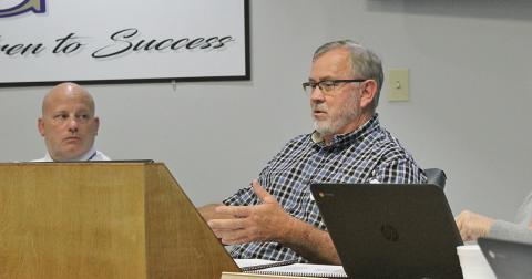 Superintendent Dr. Rob Brown (left) and board member Jim McClure speak at the Board of Education meeting on Monday.