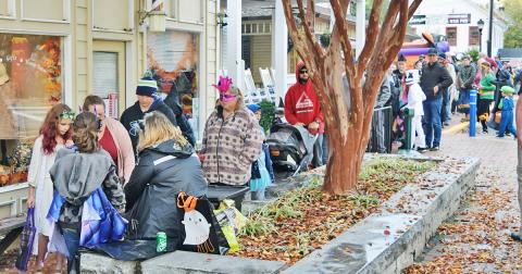 Families line the downtown square during last year's Trick or Treat event.