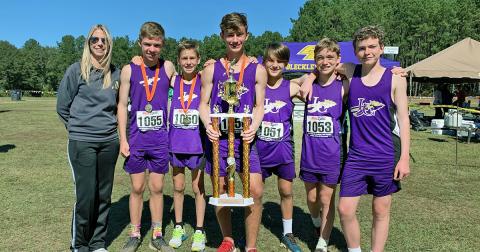 From left: head coach Brooke Flakes, Will Routhier, Sam Edwards, Wyatt Windham, Hagen Glenn, Cooper Marling and Jackson Marling.