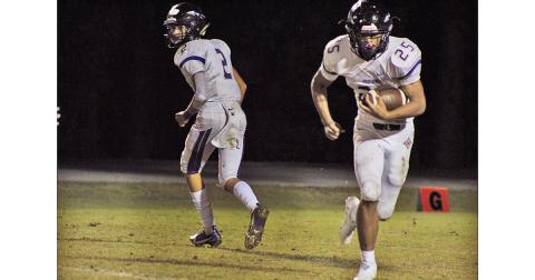 Freshman quarterback Harper Davenport looks for an open reciever downfield in Lumpkin’s game last week.
