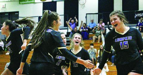 The Lumpkin County varsity volleyball team celebrates a winning point versus White County. The victory helped the Lady Indians clinch a spot in the State Tournament.