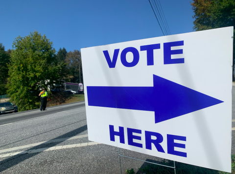An LCSO deputy stops traffic to wave in voters at the Lumpkin County Parks & Rec. community center on Tuesday.