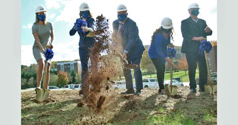Betsy Wilcauskas (from left), Dr. Mary Gowan, Dr. Mac McConnell, Lynn and Mike Cottrell break ground at the future site of the Cottrell Center for Business, Technology and Innovation.