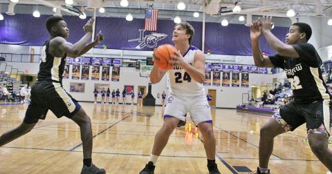 Senior Drew Allison takes a pass down low and looks to put up a shot during the Indians’ first game of the Kelly King Holiday Classic on Monday, December 21 against Mountain View High School. Both teams Lumpkin faced in the tournament challenged them with size and physical presence near the basket, something the Indians haven’t faced very much in the first half of the season.