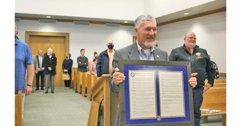 Lumpkin County Manager Stan Kelley was presented with a framed resolution, resolving to name what was once the old library building the Kelley Building, which will be home to the Development Services staff once completed. Kelley was honored in front of friends and family as well as former commissioners and other elected officials of Dahlonega and Lumpkin County, during the Nov. 17 Board of Commissioners meeting.