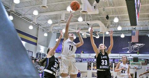 Mary Mullinax puts up a shot from the low post in the the girls’ opening game of the Kelly King Holiday Classic. Mullinax scored a season-high 13 points against Fannin in the team’s first game of the tournament on Monday, December 21.