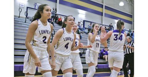 The LCHS girls basketball team starting five hype each other up before the start of a game. The Indians won in commanding fashion on Saturday, beating Lakeview Academy by 64 points.