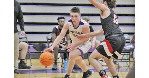 Senior point guard Gus Faulkner drives past a defender during Lumpkin’s game against Flowery Branch on Friday, Jan. 15. Faulkner led the scoring in both games last week, scoring 26 points in Tuesday’s loss to White County followed by a 22-point performance in the team’s win against Flowery Branch.