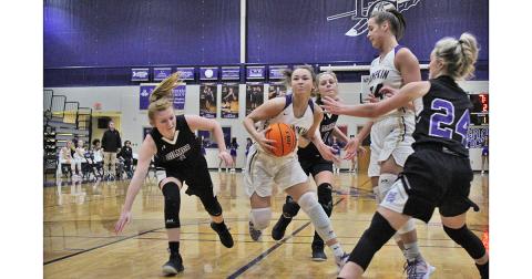 Freshman Averie Jones weaves through a host of defenders toward the hoop for a basket against Gilmer County on Friday. As the team’s leading scorer on the season, Jones adds versatility to an already lethal attack that head coach David Dowse only sees getting better.