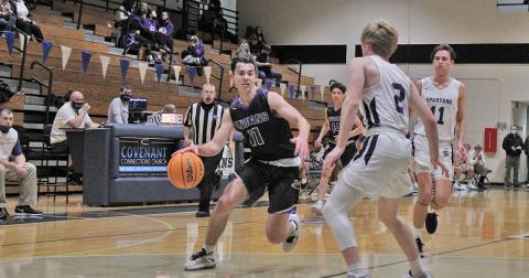 Junior guard Jones Harris drives past a defender toward the basket in the second half of the Indians’ game against West Hall. Harris tied for a game-high 16 points in the crucial region-win.