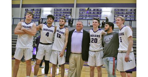 LCHS seniors (from left) Drew Allison, Brian Cunane, Chandler Pulley, head coach Michael Parker, Gus Faulkner, team manager JoJo Allison and Jacob Emmett celebrate a big win on Senior Night. The senior class was sent out with a 68-48 win and now prepare for a chance to go to the state tournament with a win in the first round of the region tournament on Thursday against North Hall.