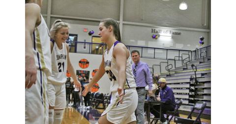 Senior MaKenzie Caldwell is greeted by her teammates as her name is announced with the starting lineup on Senior Night last Tuesday. Caldwell and fellow senior Isabel Davenport represent the first class head coach David Dowse has coached from freshmen to seniors. 
