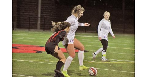 Midfielder Reagan Spivey controls the ball away from her opponent, looking to maintain possession for the Indians.