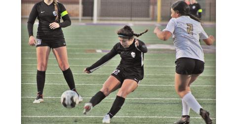 Lumpkin sophomore Nicole Limehouse strikes on goal in Lumpkin’s first action of the season, a scrimmage against East Hall on Thursday.
