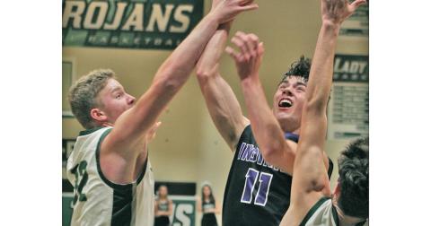 Junior guard Jones Harris puts up a shot in the team’s nail-bitting one-point loss to North Hall on Tuesday. Harris led the team with 19 points despite getting into a bit of foul trouble throughout the game.