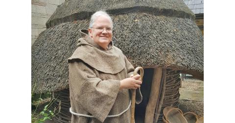 Fr. John Hamilton, rector at St. Elizabeth’s Episcopal Church, poses during a 2018 pilgrimage to Northern Ireland at a recreated monastery at North Down Museum.