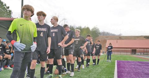 The Lumpkin County High School Varsity Boys Soccer team lines up to take the field against North Hall on Friday. Led by freshman Brauner Boegner (left) in goal, the Indians kept the clean sheet against the Trojans, holding on for a 1-0 win.