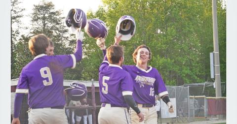 Hunter Cooper (right) celebrates with his teammates after hitting a three-run home run in Lumpkin’s season finale against Dawson County on April 23.