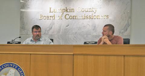 Lumpkin County Commissioners Chris Dockery and Rhett Stringer discuss the postponement of the May 6 Public Hearing and when the earliest make up meeting could occur, following a misadvertisment of the meeting.
