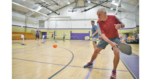 Wes Wessely returns a volley alongside teammate Don Riley during the Yahoola Creek Pickleball tournament last weekend at Parks & Rec.